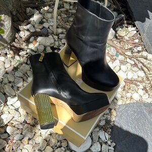 Elegant Black Leather Ankle Boots with Gold Heel